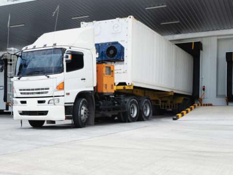 Refrigerator Truck Freezing Food. Transporting goods in the loading goods of the freezing warehouse. Storage for Ready-made foods or Ready-to-Eat Foods. Export-Import Logistics system concept.